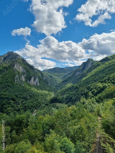 Picturesque canyon of the Tara river.Mountains surrounding the canyon.Forests on the slopes of the mountains.Haze over the mountains.  View from the Djurdzhevich Bridge Montenegro © Евгения Жигалкина