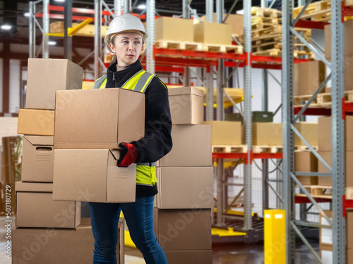 Warehouse worker woman. War...