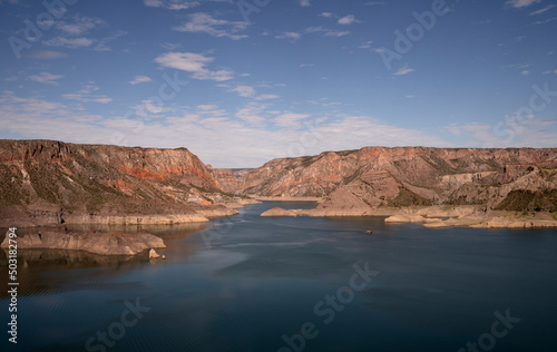 View of the lake and the Atuel canyon in San Rafael, Mendoza. Beautiful colorful mountains under a blue sky.