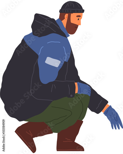 Bearded man in warm jacket standing and looking down. Serious guy in winter clothes squatting. Person in jacket, hat and gloves sits in squat. Male character looking for something in cold season
