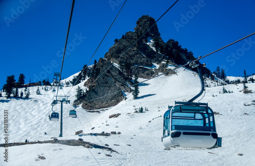 Gondola lift going up at the Snowbasin Ski Resort in Utah. photo