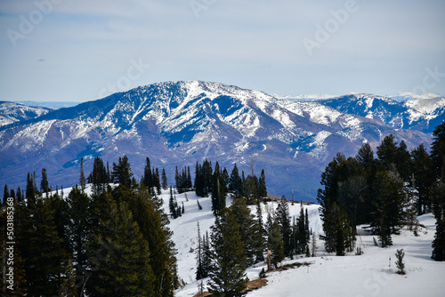 Beautiful landscape at Snowbasin Ski Resort, Utah. Range of mountains with peaks covered with snow.