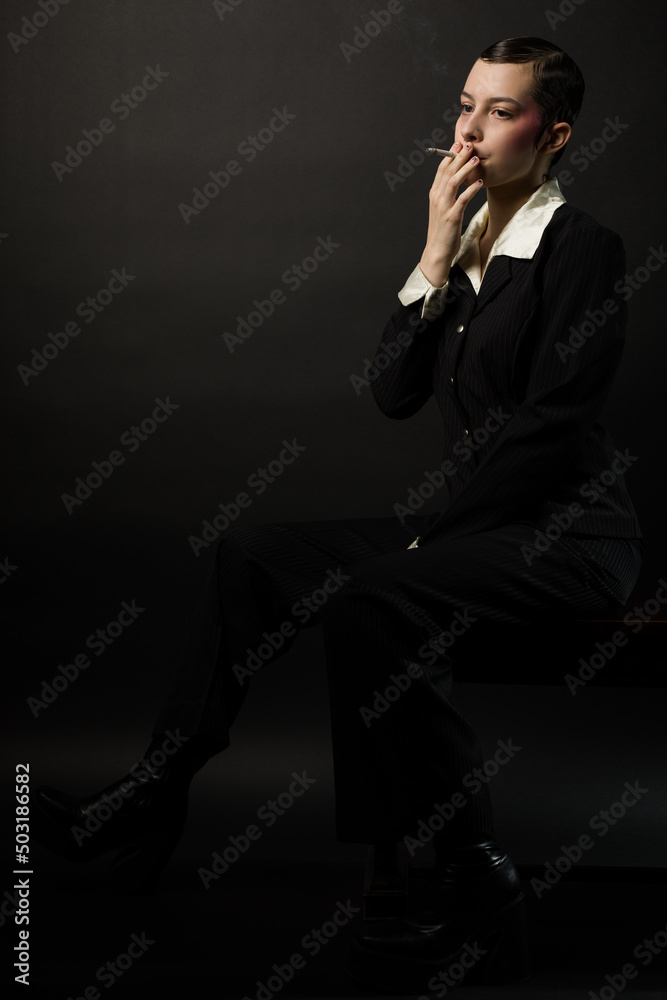 Woman Smoking Cigarette and Daydreaming Woman Smoking Cigarette and Daydreaming