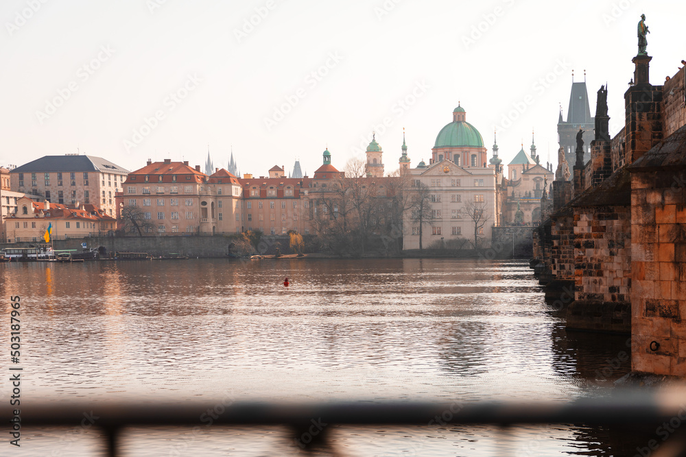 Scenic spring view of the Old Town ancient architecture and Vltava river pier in Prague, Czech Republic.