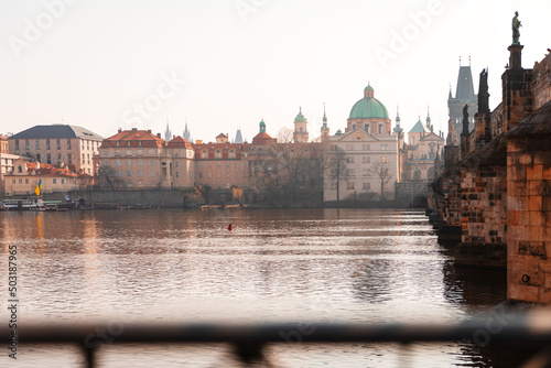 Scenic spring view of the Old Town ancient architecture and Vltava river pier in Prague, Czech Republic.