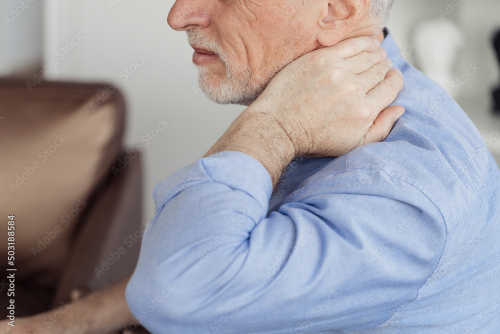 Mature aged man with neck pain, feeling sick Mature aged man with neck pain, feeling sick