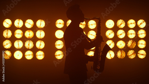 Photography Unknown jazz man saxophonist performing on stage