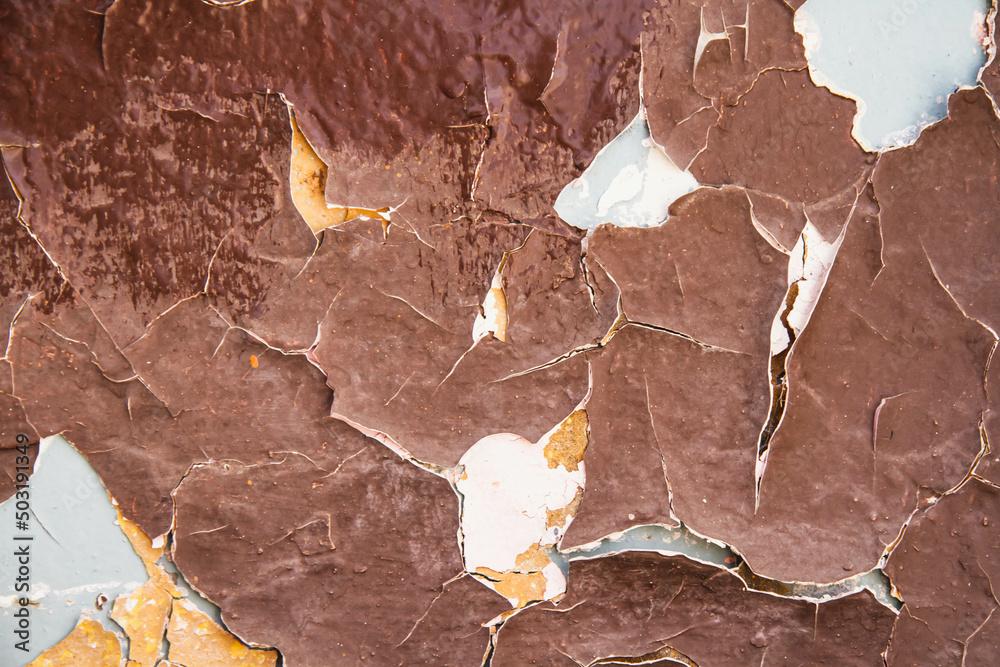 Fototapeta premium Cracked paint texture. Grunge wall texture. Dark wall with old paint