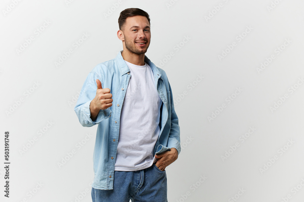 Cheerful happy tanned handsome man in casual basic t-shirt show thumb up gesture Like posing isolated on over white studio background. Copy space Banner Mockup. Lifestyle People emotions concept Cheerful happy tanned handsome man in casual basic t-shirt show thumb up gesture Like posing isolated on over white studio background. Copy space Banner Mockup. Lifestyle People emotions concept