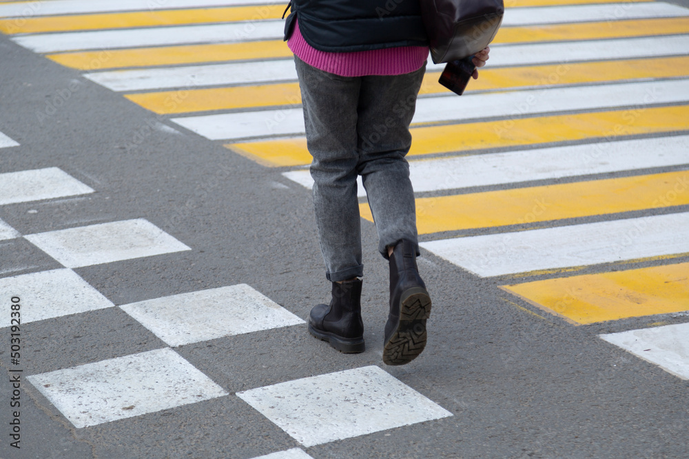 People at a pedestrian crossing in the city. Road transport interchange. People at a pedestrian crossing in the city. Road transport interchange.