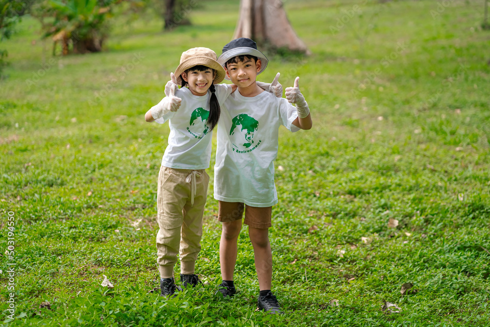 Fototapeta premium Children join as volunteers for reforestation, earth conservation activities to instill in children a sense of patience and sacrifice, doing good deeds and loving nature.
