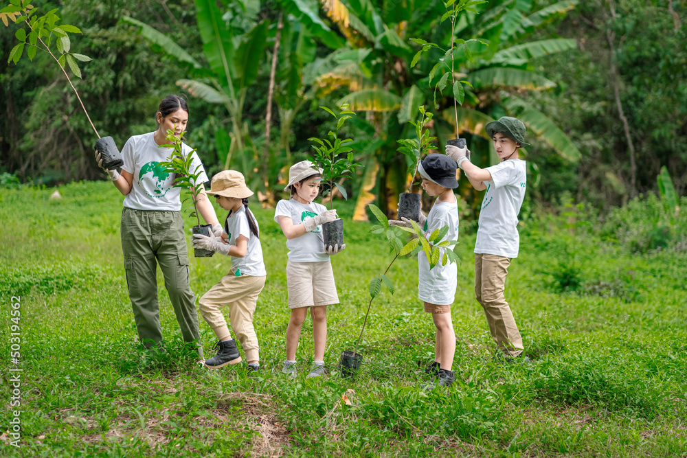 Fototapeta premium Children join as volunteers for reforestation, earth conservation activities to instill in children a sense of patience and sacrifice, doing good deeds and loving nature.
