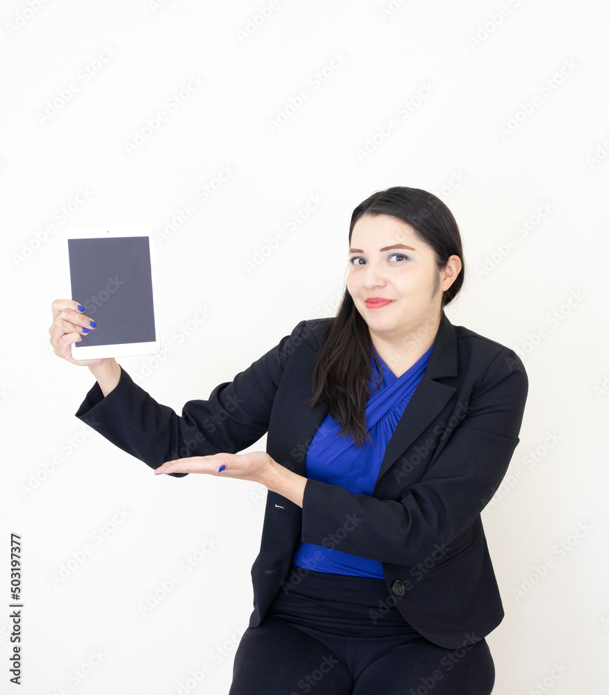 Cute and successful CEO woman, wearing black suit and blue bluse, working hard on her tablet, on white background Cute and successful CEO woman, wearing black suit and blue bluse, working hard on her tablet, on white background