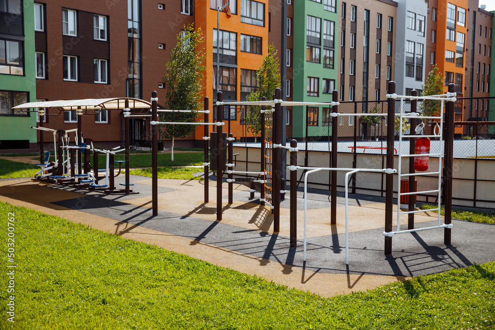 Outdoor sports ground with weight training equipment for sports. Sports and recreation area in a modern courtyard