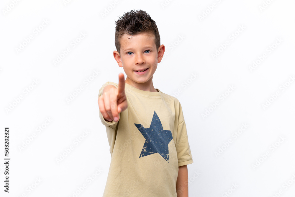 Little caucasian boy isolated on white background showing and lifting a finger Little caucasian boy isolated on white background showing and lifting a finger