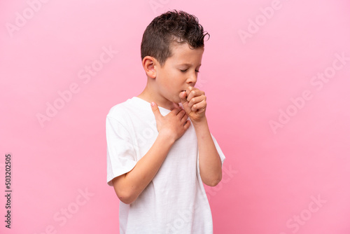 Little caucasian boy isolated on pink background coughing a lot