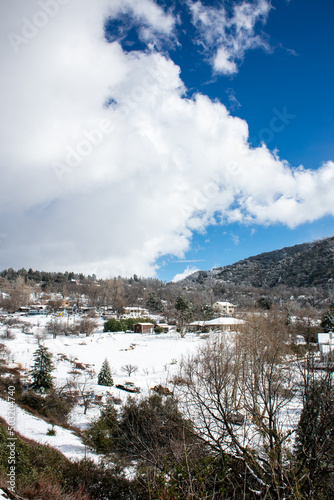 A Beautiful Snow Scene in the California Mountains with Dynamic Clouds in a Blue Sky