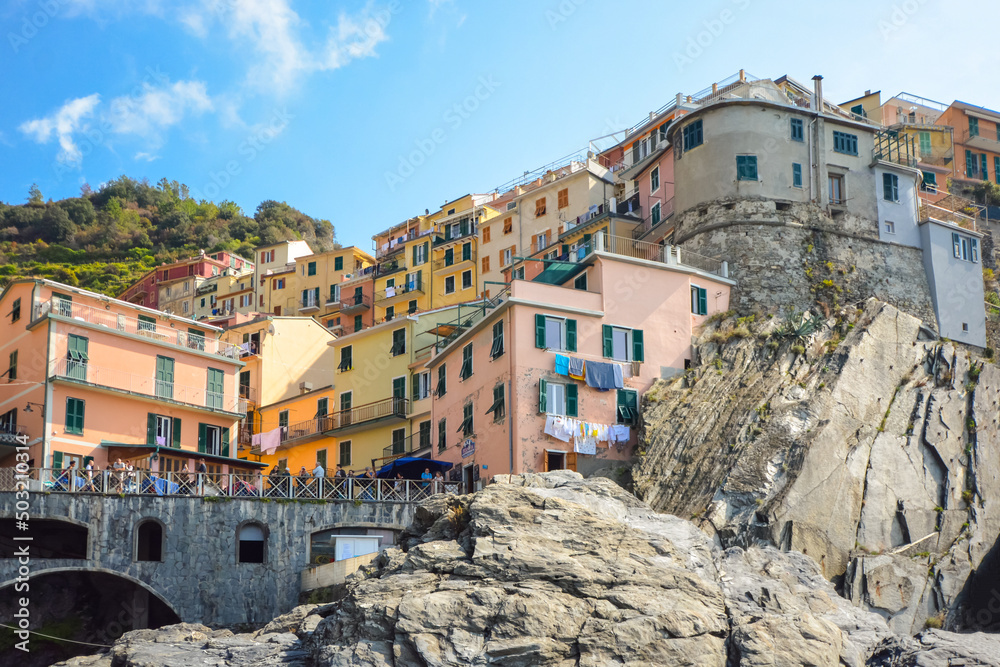 The colorful hillside homes and shops in the picturesque village of Manarola, Italy, one of the five Cinque Terre villages along the sea.
