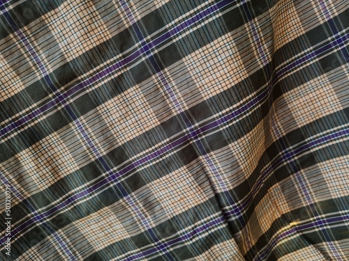Abstract background textured brown plaid sarong combined with colorful lines