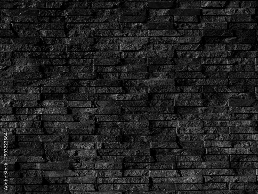 Seamless texture of black brick stone wall a rough surface, with space ...