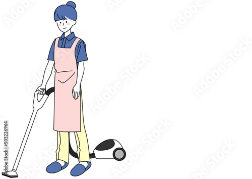 掃除機をかける女性