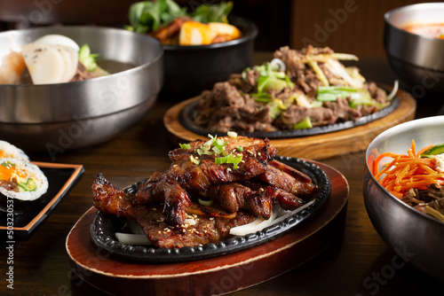 A view of several Korean entrees on the table. photo