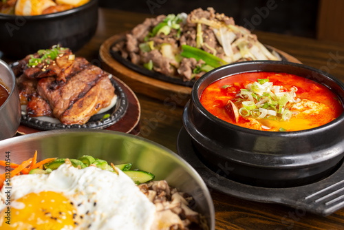 A view of several Korean entrees on the table.
