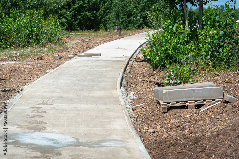 Construction of a path (pavement) for cyclists and people in the park. Construction of a path (pavement) for cyclists and people in the park.