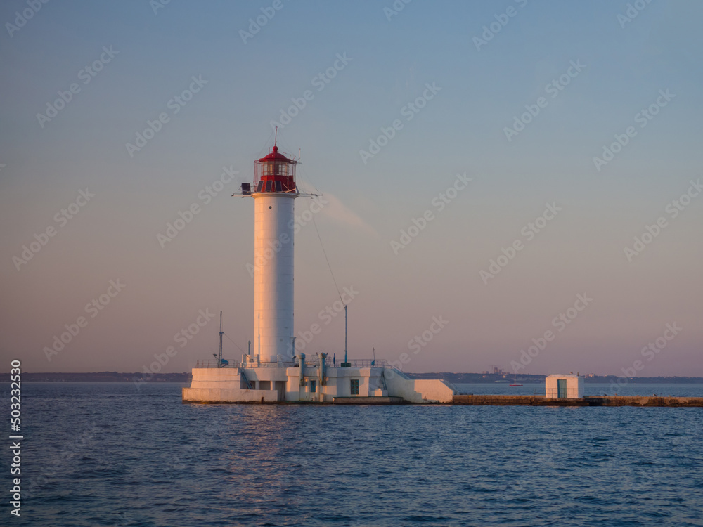 The Vorontsov Lighthouse in the Black Sea port of Odessa, Ukraine in the evening. The current lighthouse is the third to stand on the same spot. The first was built in 1862 and was made of wood. The Vorontsov Lighthouse in the Black Sea port of Odessa, Ukraine in the evening. The current lighthouse is the third to stand on the same spot. The first was built in 1862 and was made of wood.