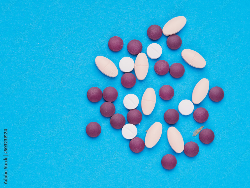pharmaceutical over-the-counter or prescription pills, on a blue background pharmaceutical over-the-counter or prescription pills, on a blue background
