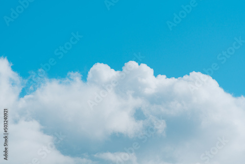 Bright blue sky with white fluffy clouds. Beauty of nature. Aerial natural background © Rina Mskaya