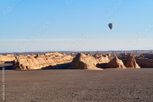 hot air balloon over yardang landforms in dunhuang national geopark, gansu, china photo