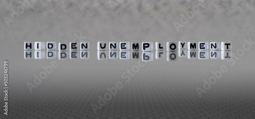 hidden unemployment word or concept represented by black and white letter cubes on a grey horizon background stretching to infinity