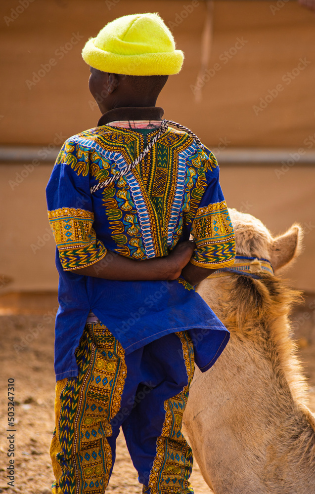 The African dress is present in the Arab camel races
