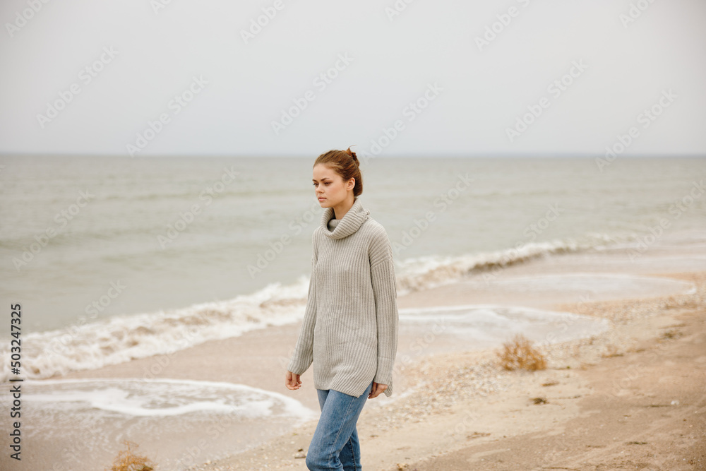 beautiful woman cloudy weather by the sea travel fresh air unaltered