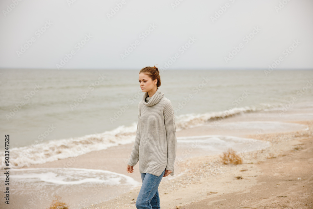 beautiful woman cloudy weather by the sea travel fresh air unaltered beautiful woman cloudy weather by the sea travel fresh air unaltered