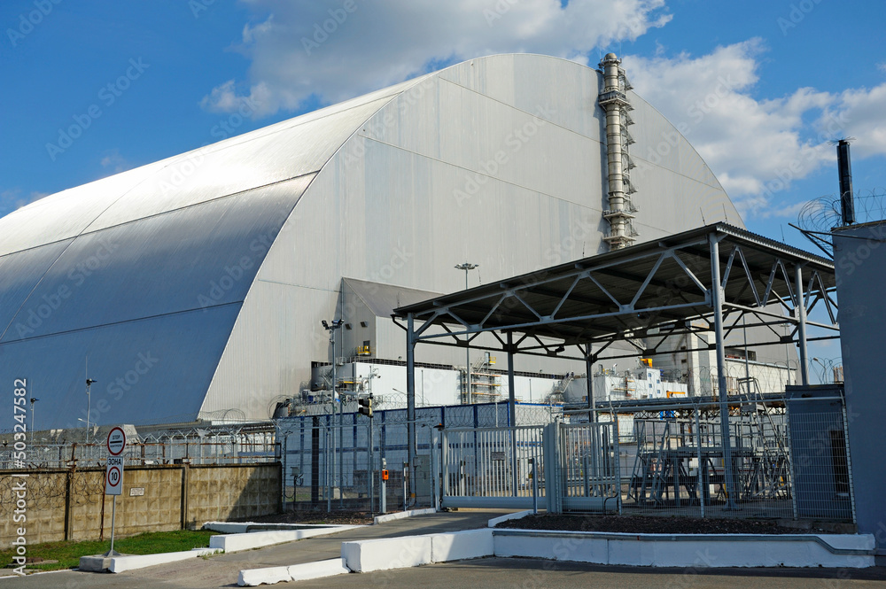 View of the Chernobyl New Safe Confinement and electrical substation