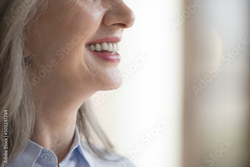 Free Download Happy mature woman toothy smile side view. Positive senior lady showing row of healthy white teeth, implants, veneers, promoting dentist service, enamel cleaning, whitening. Dental care concept - GFXLoad