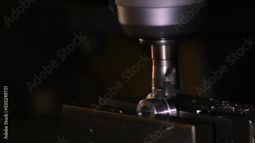 Close-up industrial metalworking cutting automation process by milling CNC.Micro machining process , Coolant and lubrication.Close up of CNC machine at work. photo