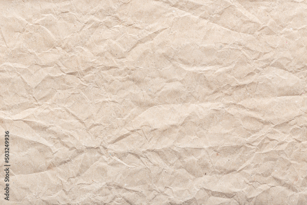 Crumpled paper background texture. Brown paper background Crumpled paper background texture. Brown paper background