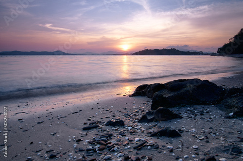 Beautiful landscape with colorful sunset on the sea.