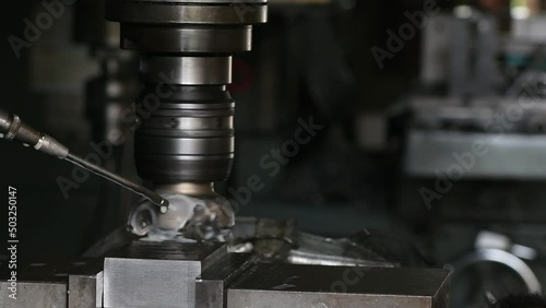 Industrial metalworking cutting automation process by milling CNC.Micro machining process , Coolant and lubrication.Close up of CNC machine at work.