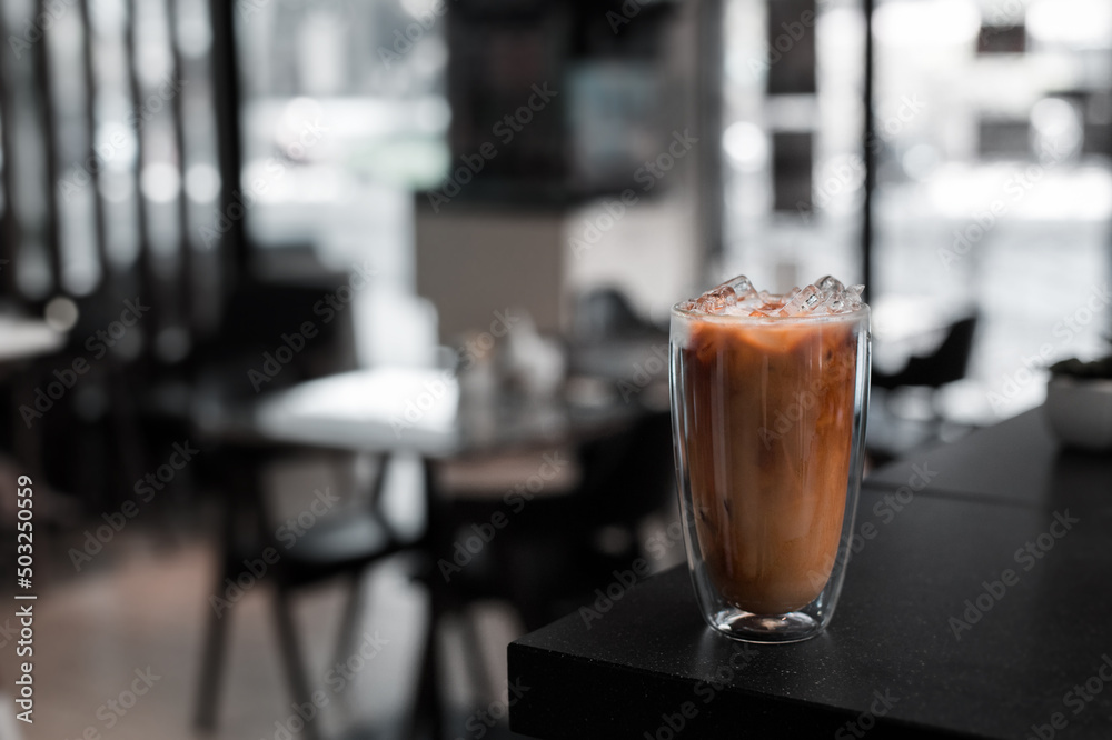 glass of iced coffee with milk on the table glass of iced coffee with milk on the table