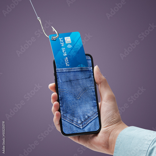 Vászonkép Hacker stealing credit card information on a smartphone