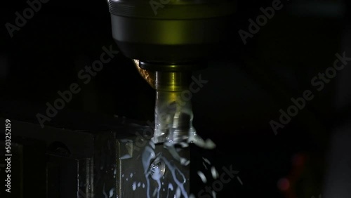 Industrial metalworking cutting automation process by milling CNC.Micro machining process , Coolant and lubrication.Close up of CNC machine at work. photo