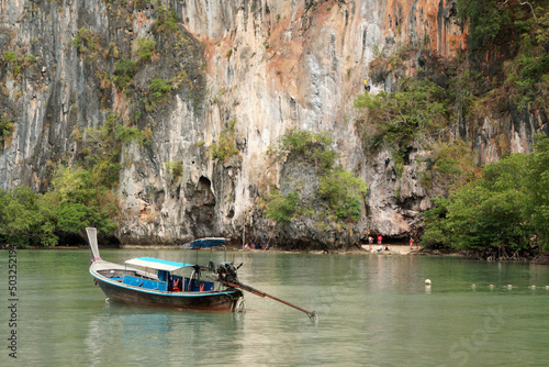 Landscape Thai traditional long tail boat in Railay Ao nang Krabi Thailand - sunny day summer Transport 