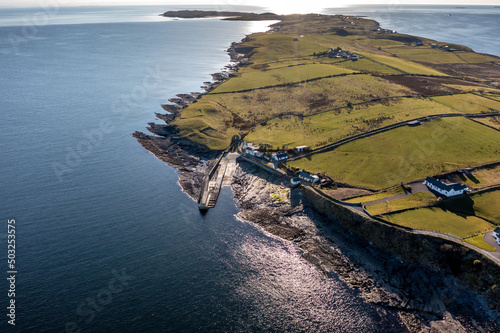 Aerial view of the Ballysaggart pier and the 15th century Franciscan Third Order remains at St Johns Point in County Donegal - Ireland.