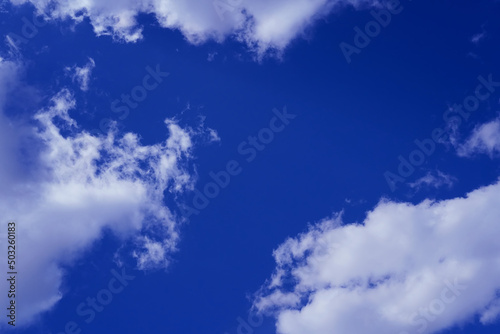 Blue sky with white clouds. Abstraction. Background
