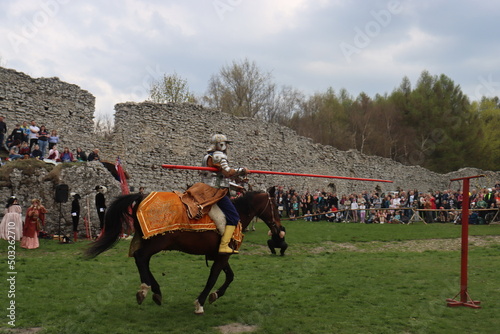 a hussar on a rotten mare in a leopard cape and chain mail gallops with a sword on the preponderance Ogrodzeniec Malopolska Poland photo