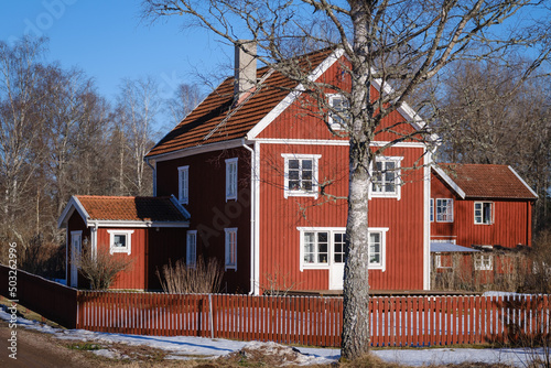 Typical Swedish falu red house with white windows photo